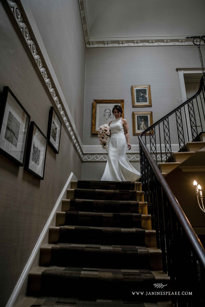 Bride Walking down the stairs at Sweeney Hall Morda