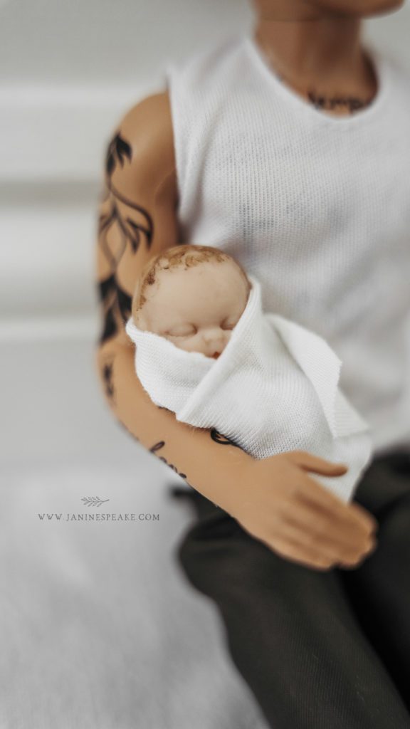 Ken doll with his newborn baby